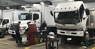 Servicing two Hino trucks