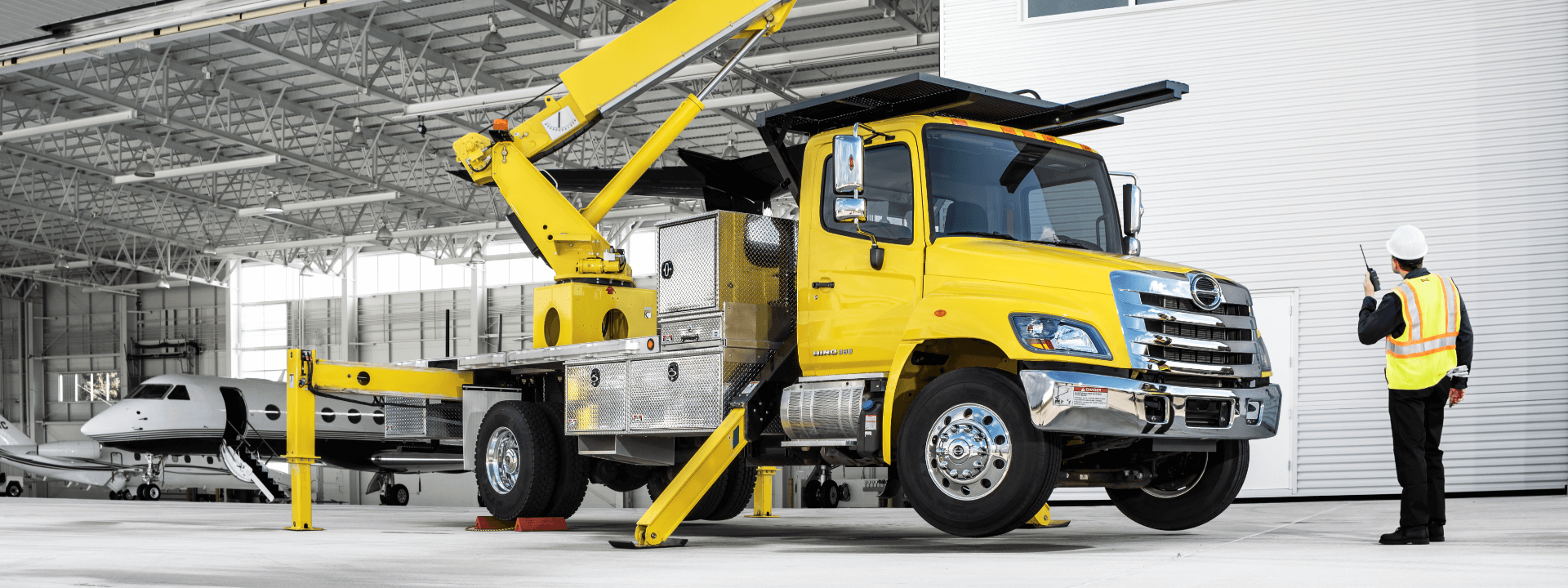 Yellow Hino truck on a construction site